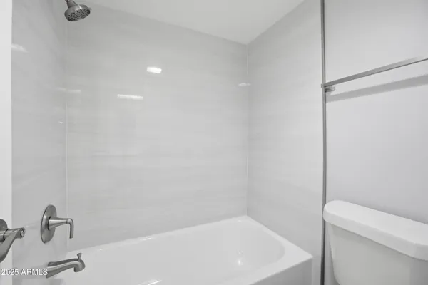 a bathroom with a sink a toilet and a bathtub