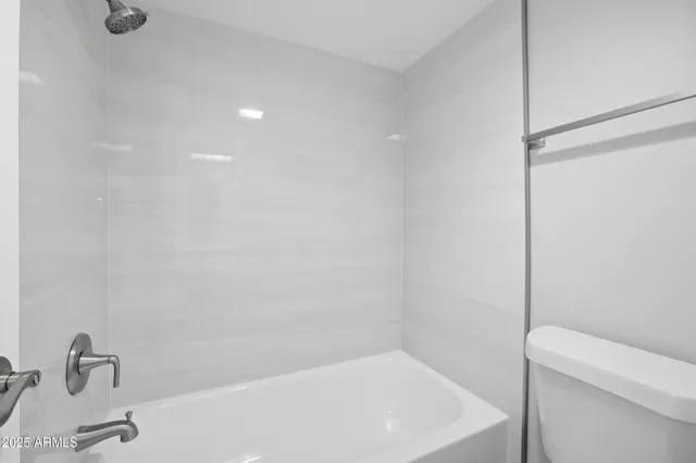 a bathroom with a sink a toilet and a bathtub