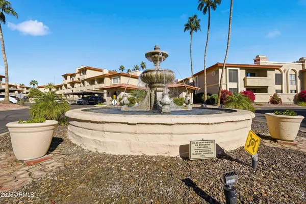 a view of a street with a building in the background