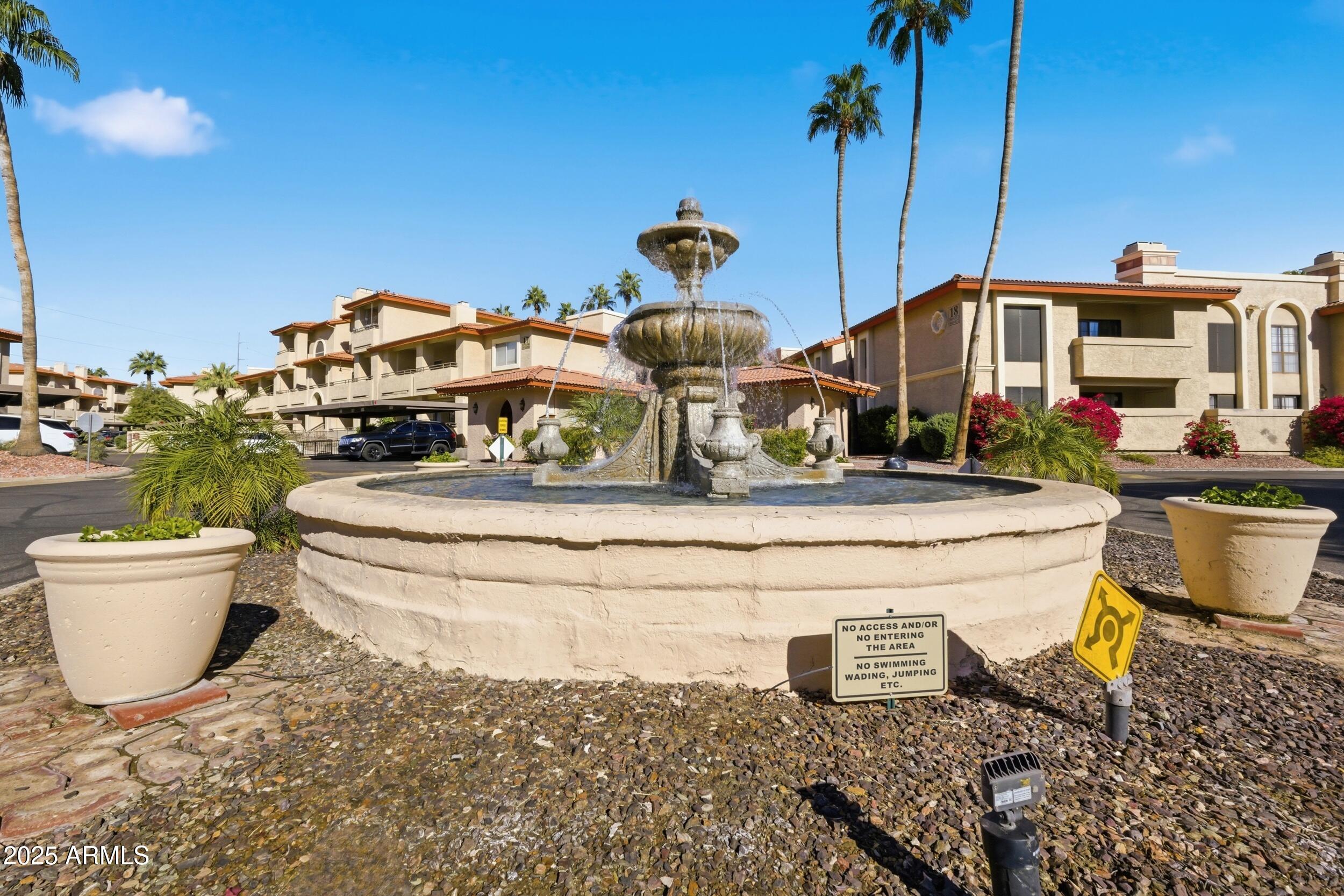10410 North Cave Creek Road, Unit 2027 Phoenix, AZ 85020 - Photo 20 of 28 a front view of a house with a yard