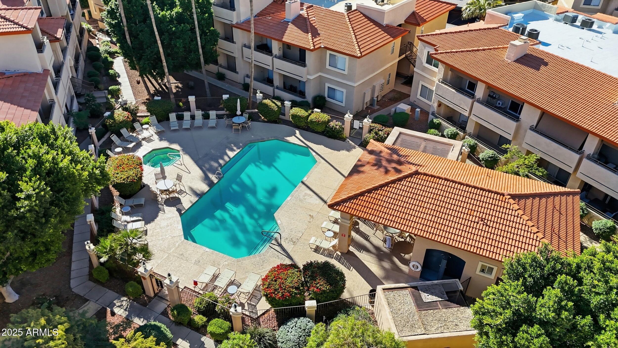 10410 North Cave Creek Road, Unit 2027 Phoenix, AZ 85020 - Photo 24 of 28 an aerial view of a house with a yard and potted plants