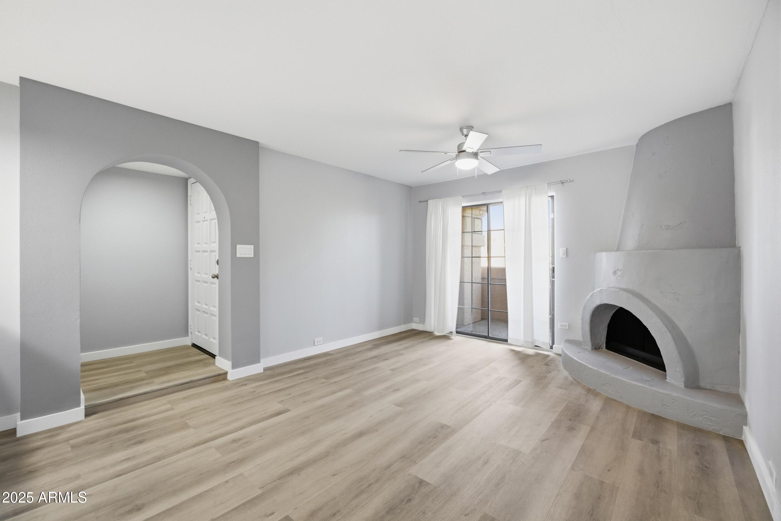 10410 North Cave Creek Road, Unit 2027 Phoenix, AZ 85020 - Photo 2 of 28 a view of empty room with fireplace