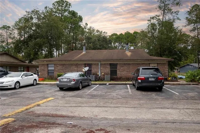 a view of street with parked cars