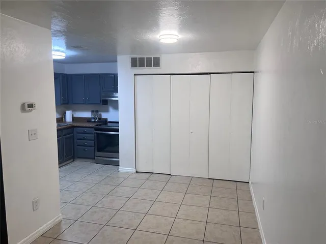 a view of an empty room and wooden floor