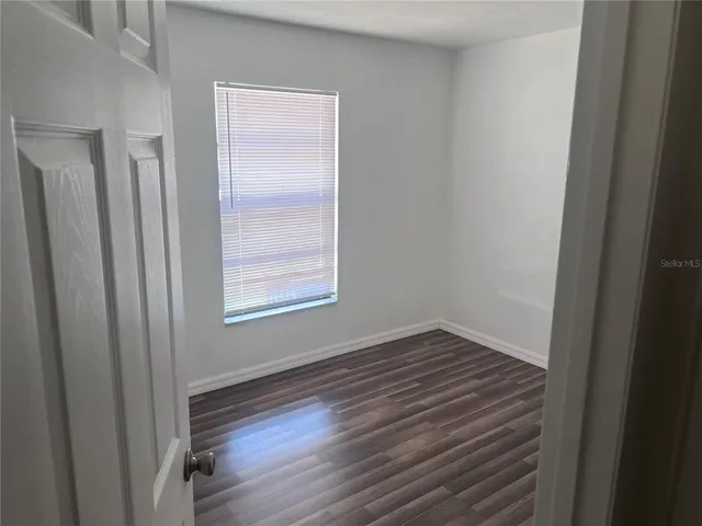 a bathroom with a bathtub shower sink vanity and a toilet