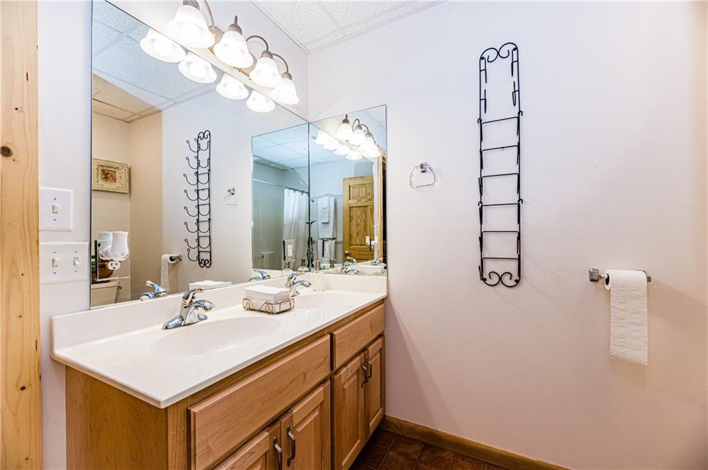 15 Alm Strasse Helen, GA 30545 - Photo 25 of 71 a bathroom with a sink a mirror and a shower