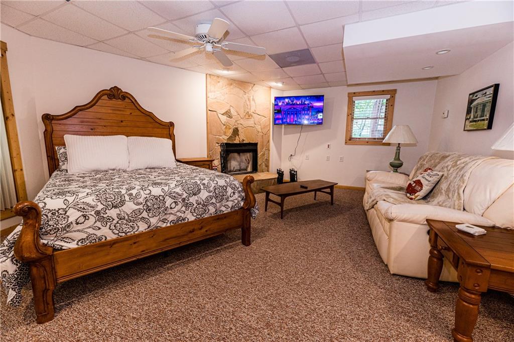 15 Alm Strasse Helen, GA 30545 - Photo 31 of 71 a bedroom with a bed a couch and dresser