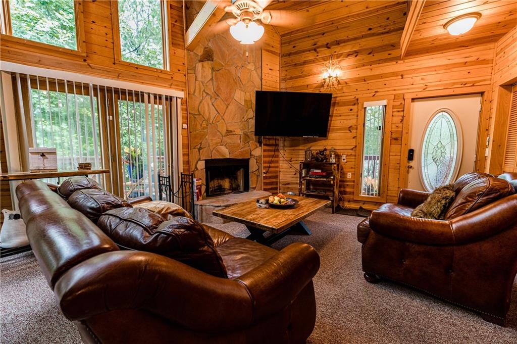15 Alm Strasse Helen, GA 30545 - Photo 40 of 71 a living room with furniture fireplace and a flat screen tv