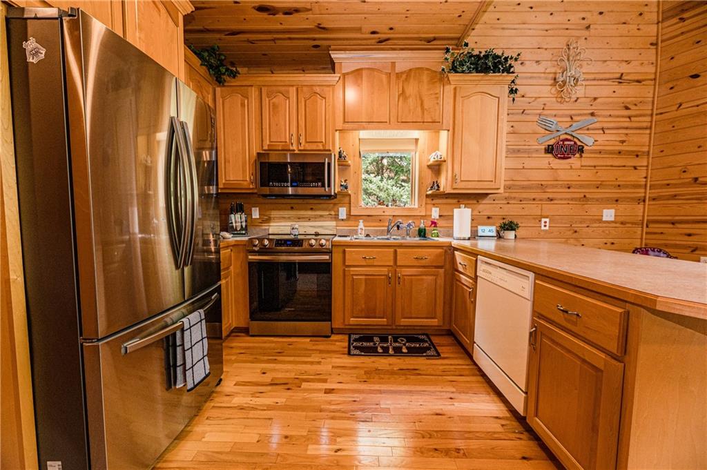 15 Alm Strasse Helen, GA 30545 - Photo 42 of 71 a kitchen with stainless steel appliances a refrigerator and a sink