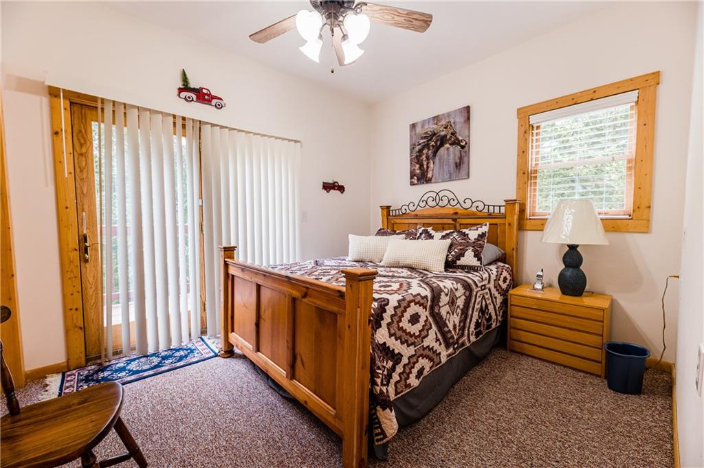 15 Alm Strasse Helen, GA 30545 - Photo 48 of 71 a bed room with a bed and a chandelier