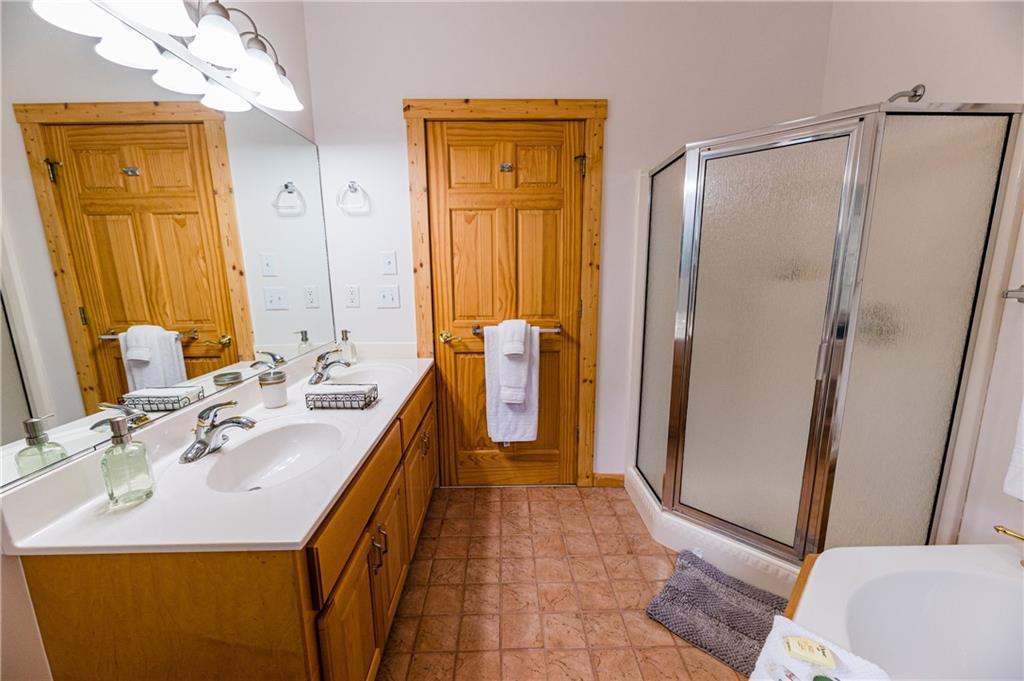 15 Alm Strasse Helen, GA 30545 - Photo 65 of 71 a bathroom with a sink a mirror and a shower