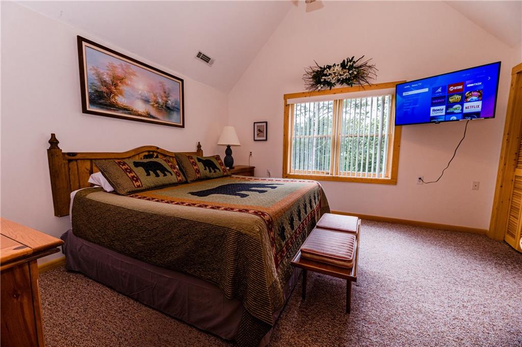 15 Alm Strasse Helen, GA 30545 - Photo 66 of 71 a bed room with a bed and a chair