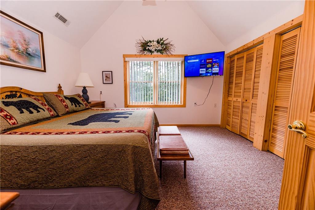 15 Alm Strasse Helen, GA 30545 - Photo 67 of 71 a bedroom with furniture and a window