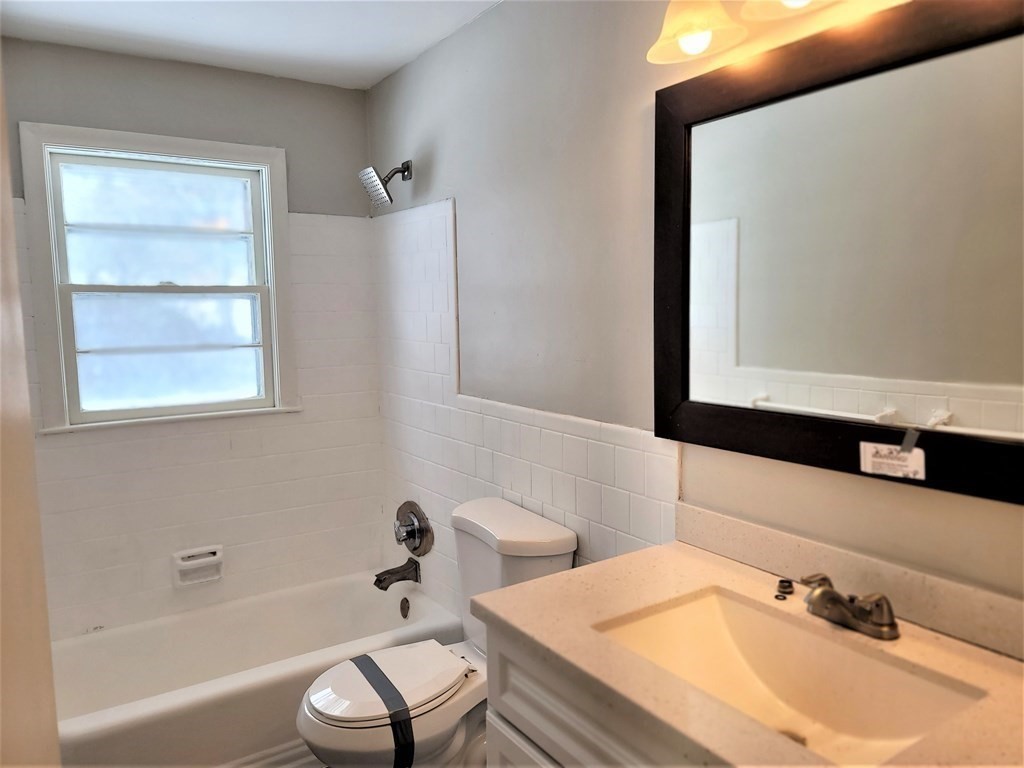 4 Allen Road Billerica, MA 01821 - Photo 11 of 24 a bathroom with a sink and a mirror