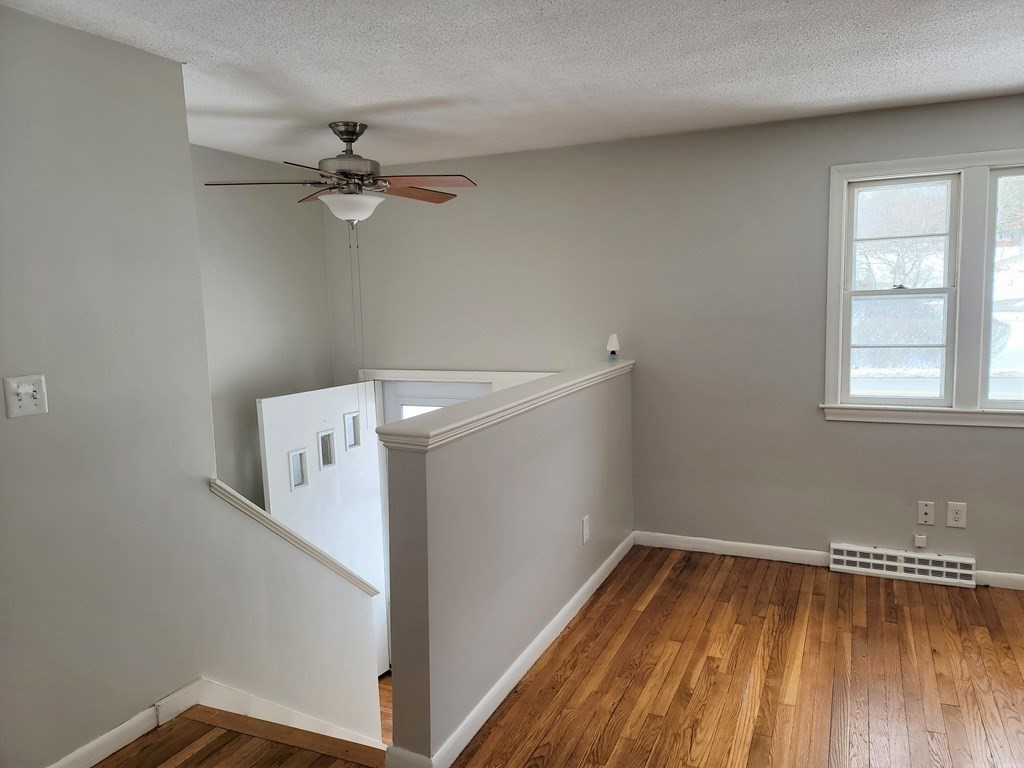 4 Allen Road Billerica, MA 01821 - Photo 7 of 24 a view of a room with wooden floor and fan