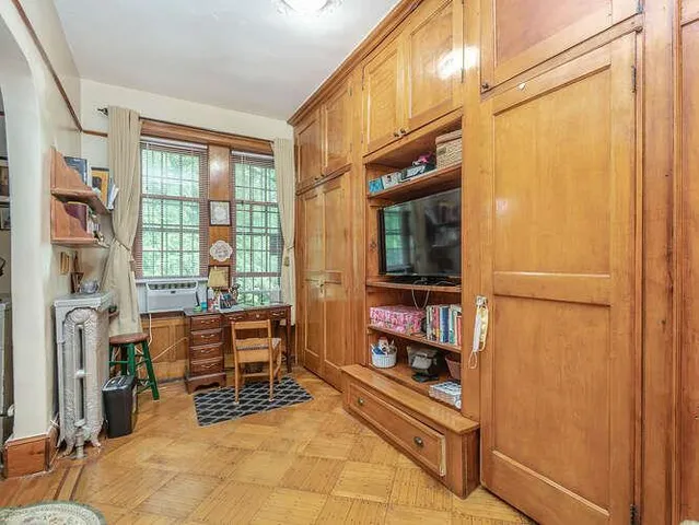 a room with multiple dryer and windows