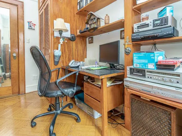a table chair sitting in a kitchen next to a building