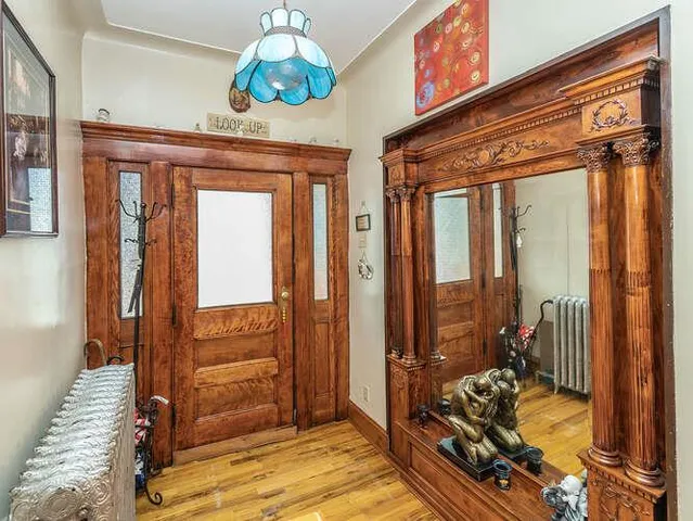 a bedroom with furniture and large windows