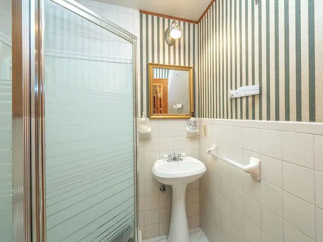 a bathroom with a sink and mirror