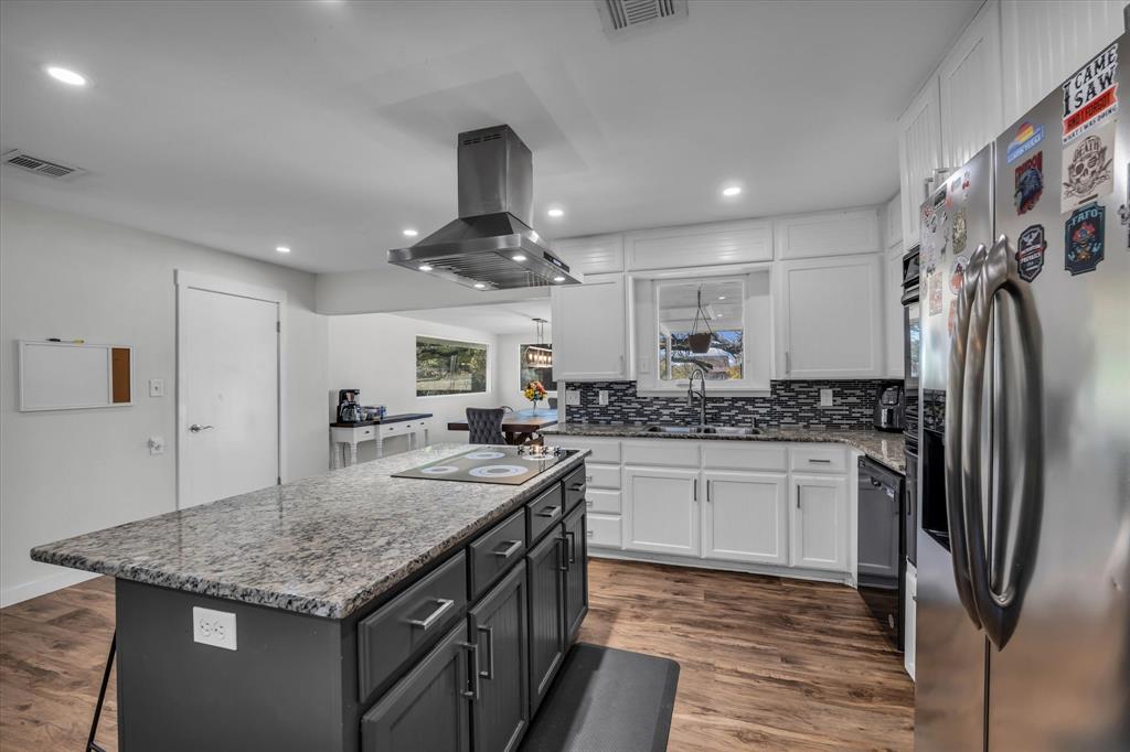 1835 Ft Graham Road Waco, TX 76705 - Photo 12 of 40 a kitchen with stainless steel appliances granite countertop a sink and stove