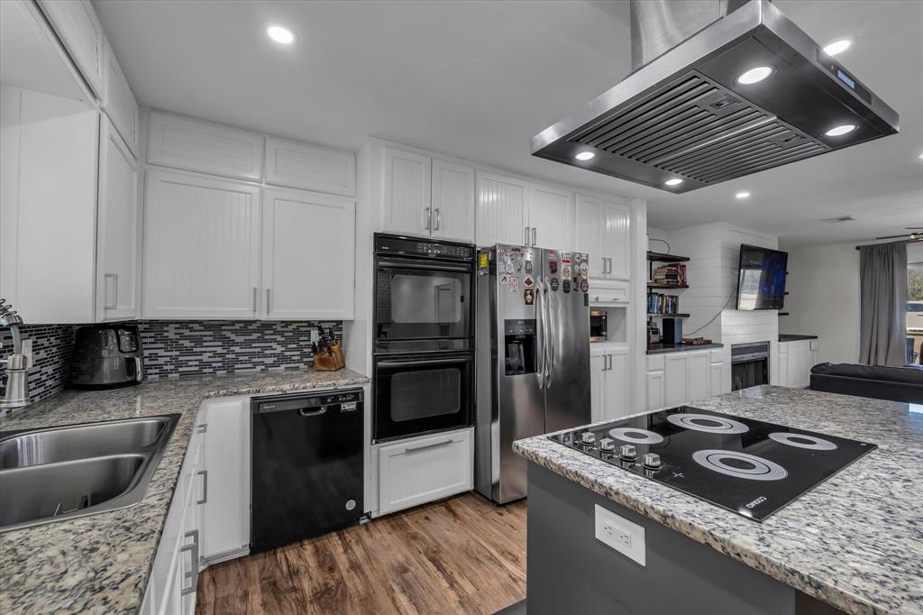 1835 Ft Graham Road Waco, TX 76705 - Photo 13 of 40 a kitchen with stainless steel appliances granite countertop a sink stove and refrigerator