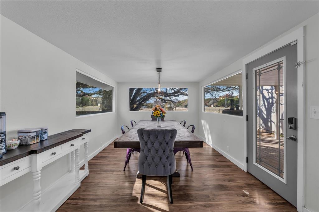 1835 Ft Graham Road Waco, TX 76705 - Photo 14 of 40 a view of a dining room with furniture window and wooden floor
