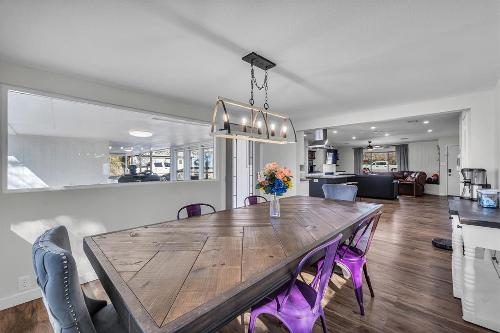 1835 Ft Graham Road Waco, TX 76705 - Photo 15 of 40 a living room with dining room and wooden floor