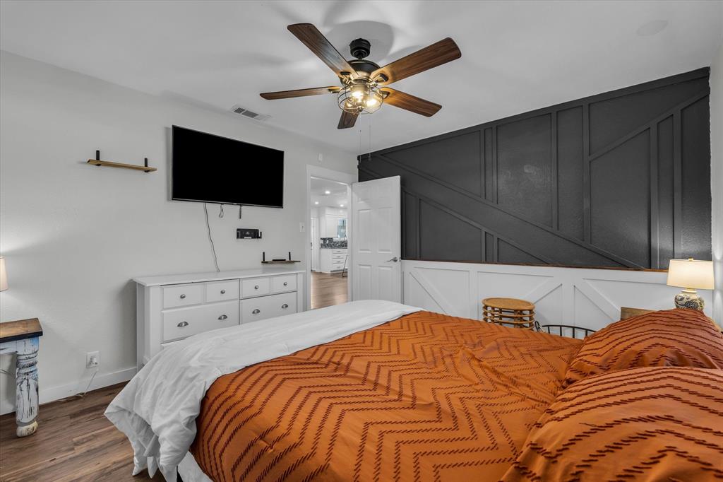 1835 Ft Graham Road Waco, TX 76705 - Photo 16 of 40 a bedroom with a bed and a flat screen tv