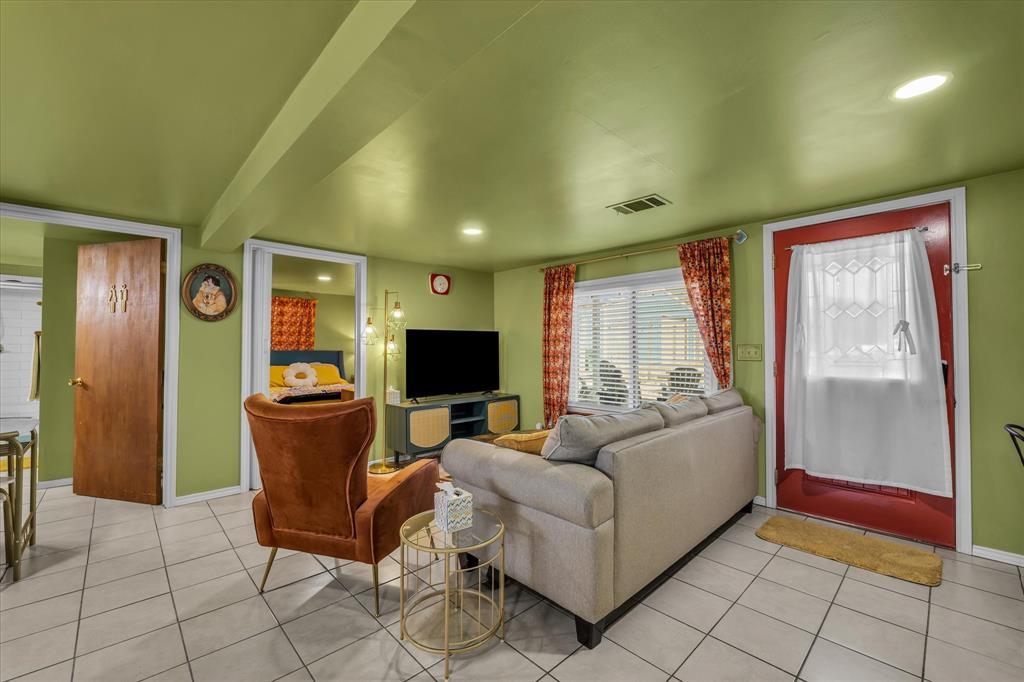 1835 Ft Graham Road Waco, TX 76705 - Photo 27 of 40 a living room with furniture a flat screen tv and a window