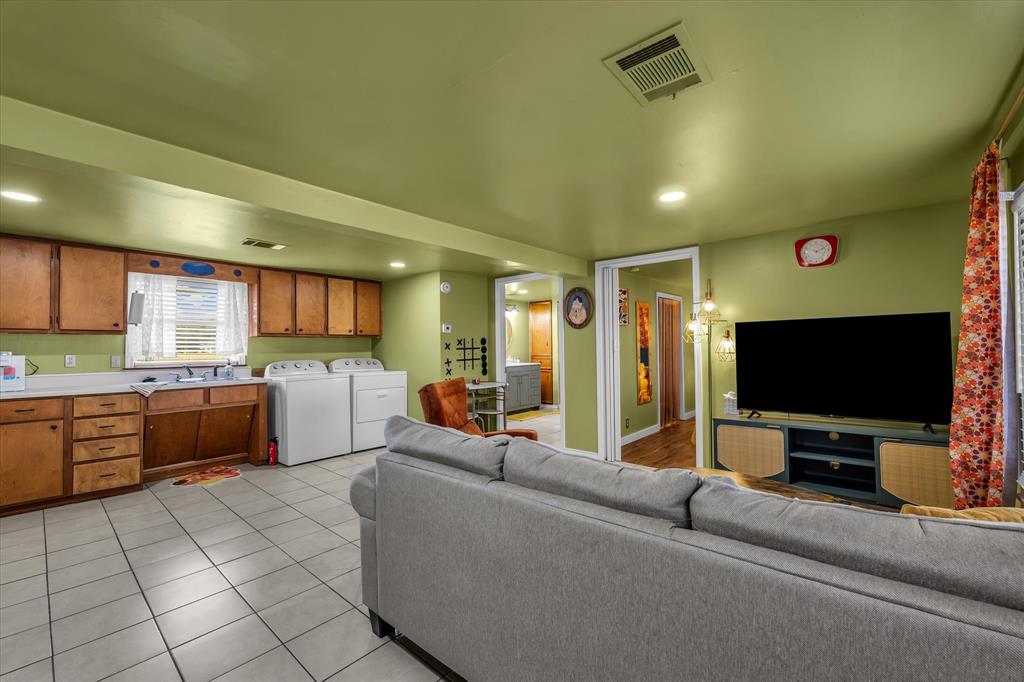 1835 Ft Graham Road Waco, TX 76705 - Photo 32 of 40 a living room with furniture and a flat screen tv