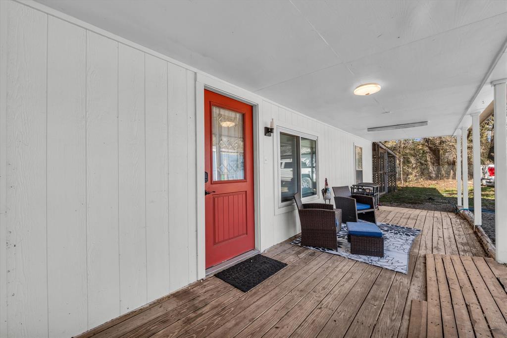 1835 Ft Graham Road Waco, TX 76705 - Photo 34 of 40 a living room with furniture and a wooden floor