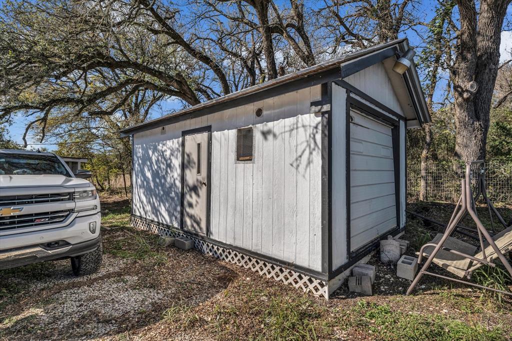 1835 Ft Graham Road Waco, TX 76705 - Photo 38 of 40 a view of a backyard with stairs and a trees