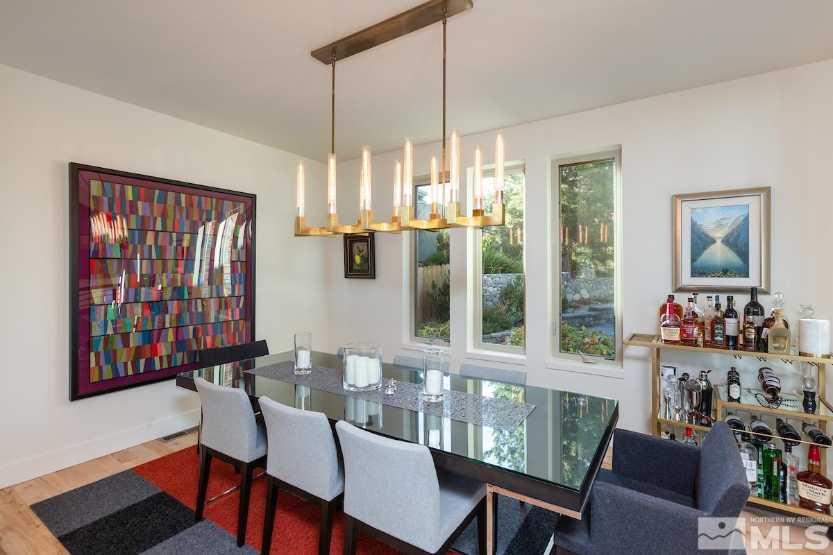 3275 Trumpeter Court Reno, NV 89509 - Photo 6 of 25 a view of a dining room with furniture window and wooden floor