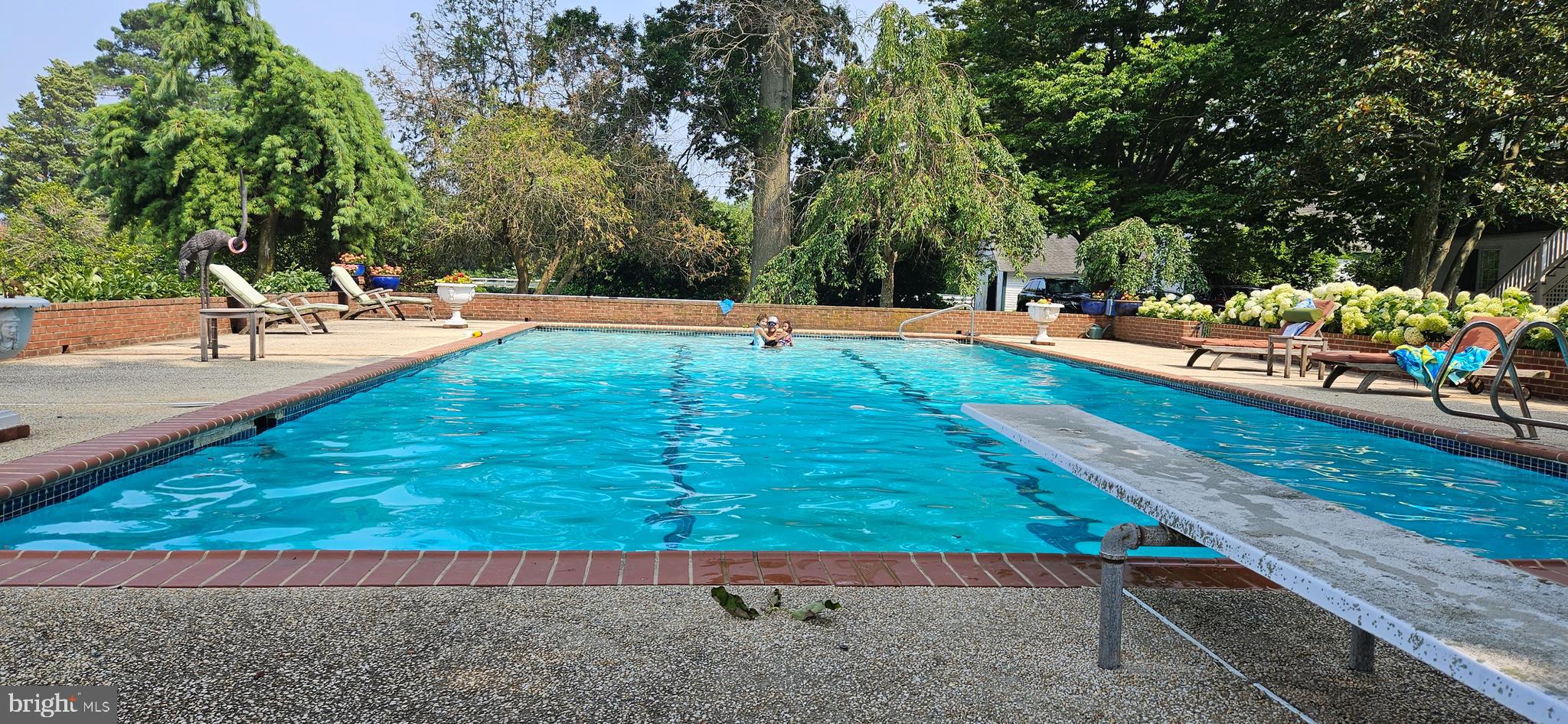 10770 Rich Neck Road Claiborne, MD 21624 - Photo 12 of 107 a view of a swimming pool with a patio