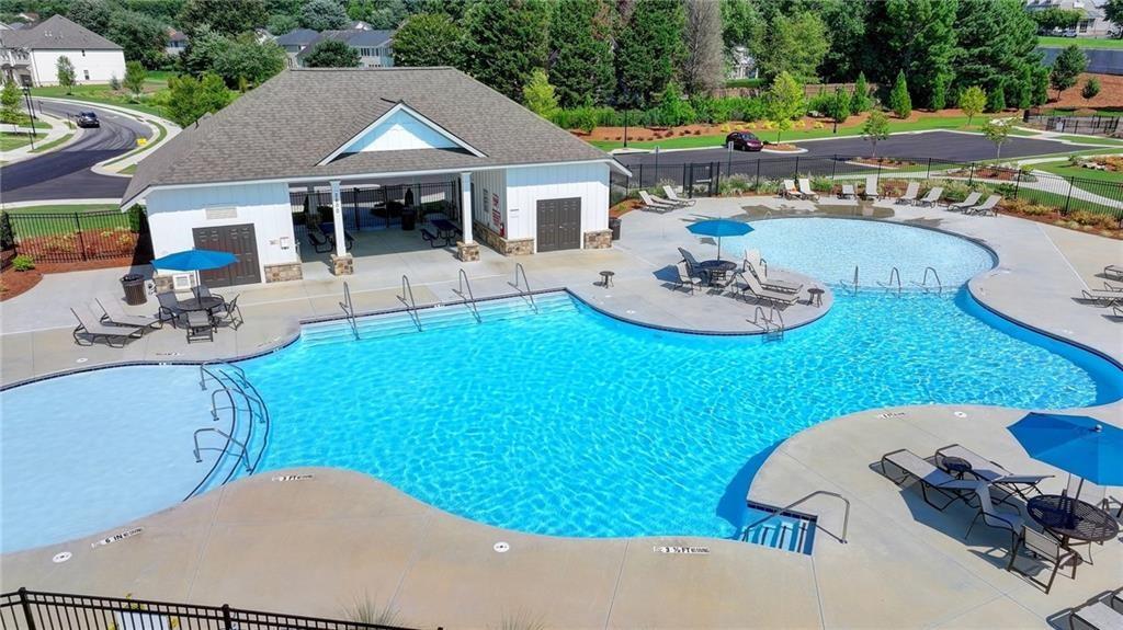 4078 Haleston Road Duluth, GA 30097 - Photo 22 of 25 a view of a house with backyard patio and swimming pool