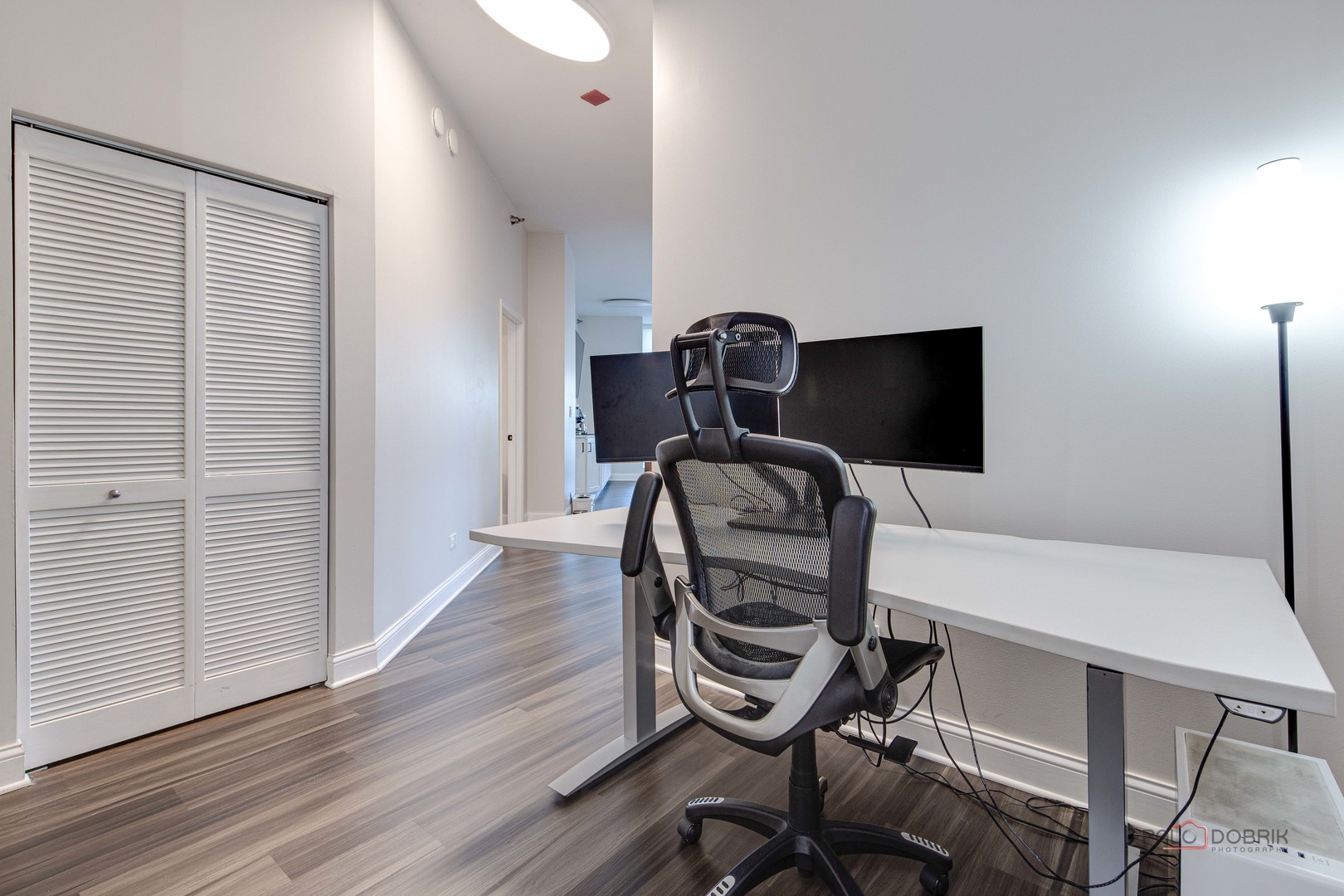 1600 South Indiana Avenue, Unit 803 Chicago, IL 60616 - Photo 5 of 24 a view of a workspace with furniture and wooden floor