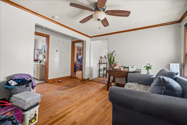 a bedroom with furniture and a ceiling fan