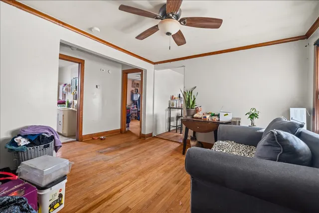 a bedroom with furniture and a ceiling fan