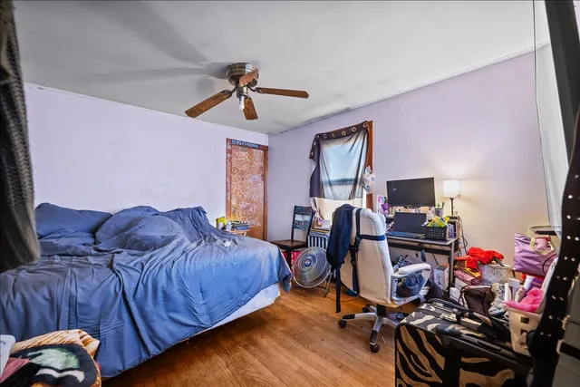 a bed room with a bed and a desk