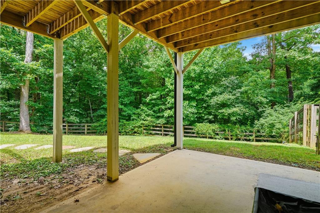302 Spence Circle Ball Ground, GA 30107 - Photo 38 of 55 a view of a yard with porch and tree
