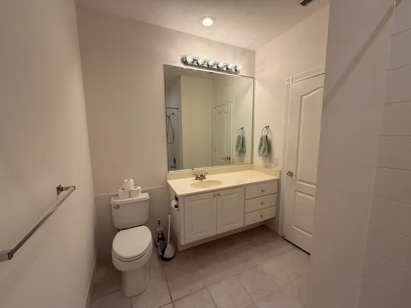 a bathroom with a shower and a bath tub