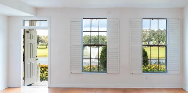 a view of an empty room with a window