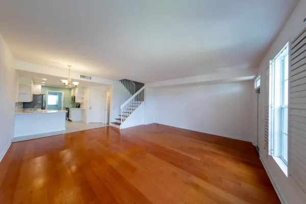 a large kitchen with kitchen island a sink stainless steel appliances and cabinets