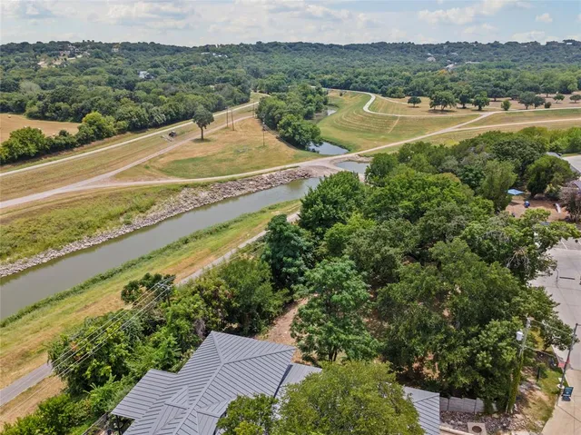a view of a lake with a garden and houses view