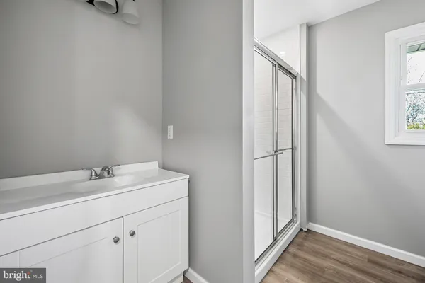 a bathroom with a sink and mirror