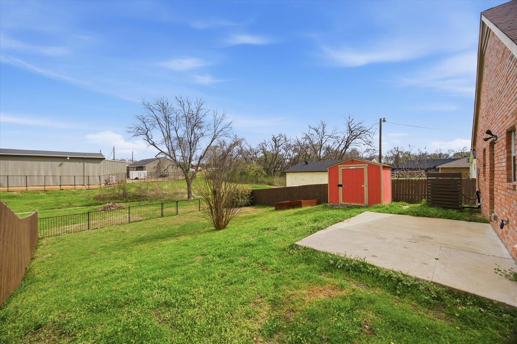 709 Sherman Street Rockwall, TX 75087 - Photo 12 of 23 a view of backyard with swimming pool