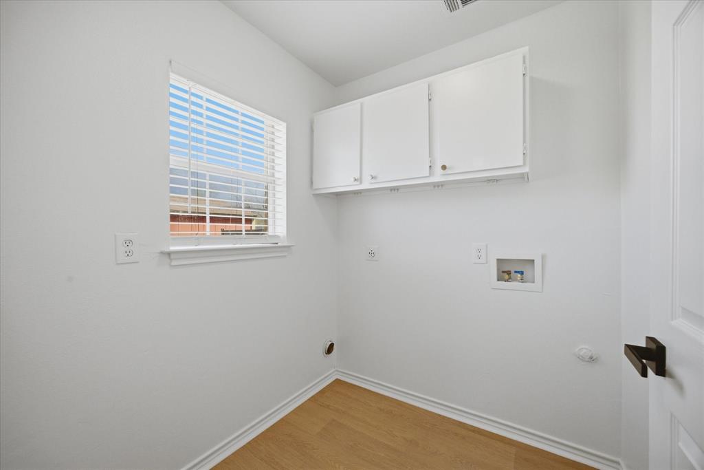 709 Sherman Street Rockwall, TX 75087 - Photo 17 of 23 wooden floor in an empty room