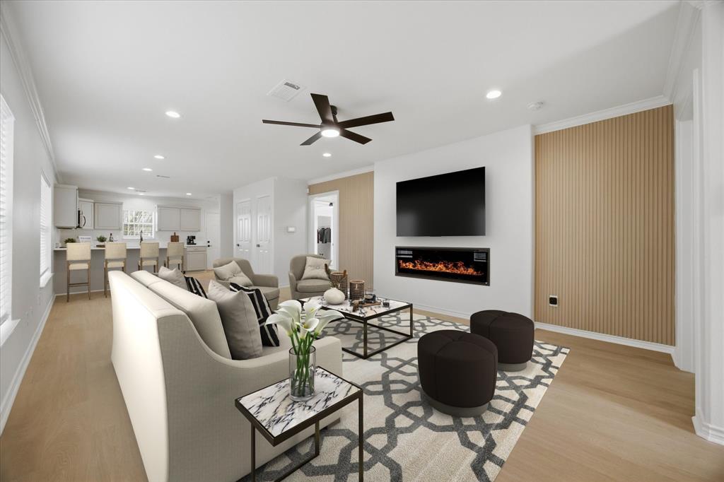 709 Sherman Street Rockwall, TX 75087 - Photo 2 of 23 a living room with furniture and a flat screen tv