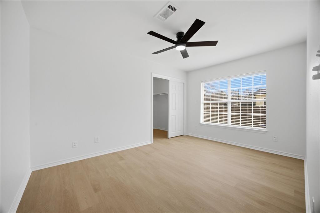 709 Sherman Street Rockwall, TX 75087 - Photo 22 of 23 a view of a livingroom with a ceiling fan and window