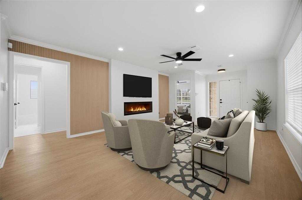 709 Sherman Street Rockwall, TX 75087 - Photo 3 of 23 a living room with furniture and a flat screen tv